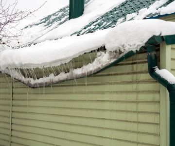 How to Prevent Ice Dams and Water Damage on Your Roof