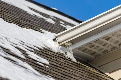 How to Prevent Ice Dams and Water Damage on Your Roof