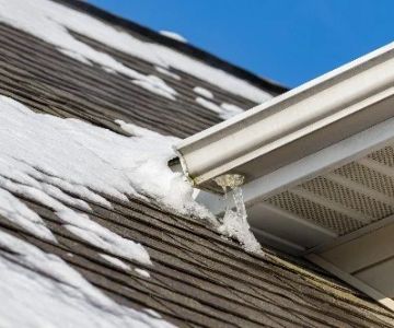 How to Prevent Ice Dams and Water Damage on Your Roof