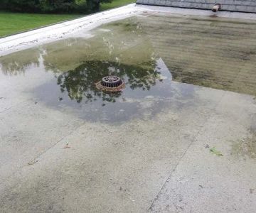 How to Prevent Water Pooling (Ponding) on Flat Commercial Roofs