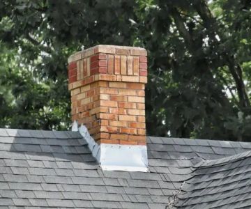 Roofing Around Chimneys: Proper Flashing & Cap Installation for Roof Health