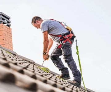 Roofing Safety: Ladders, Harnesses, & Professional Standards for Safe Roofing
